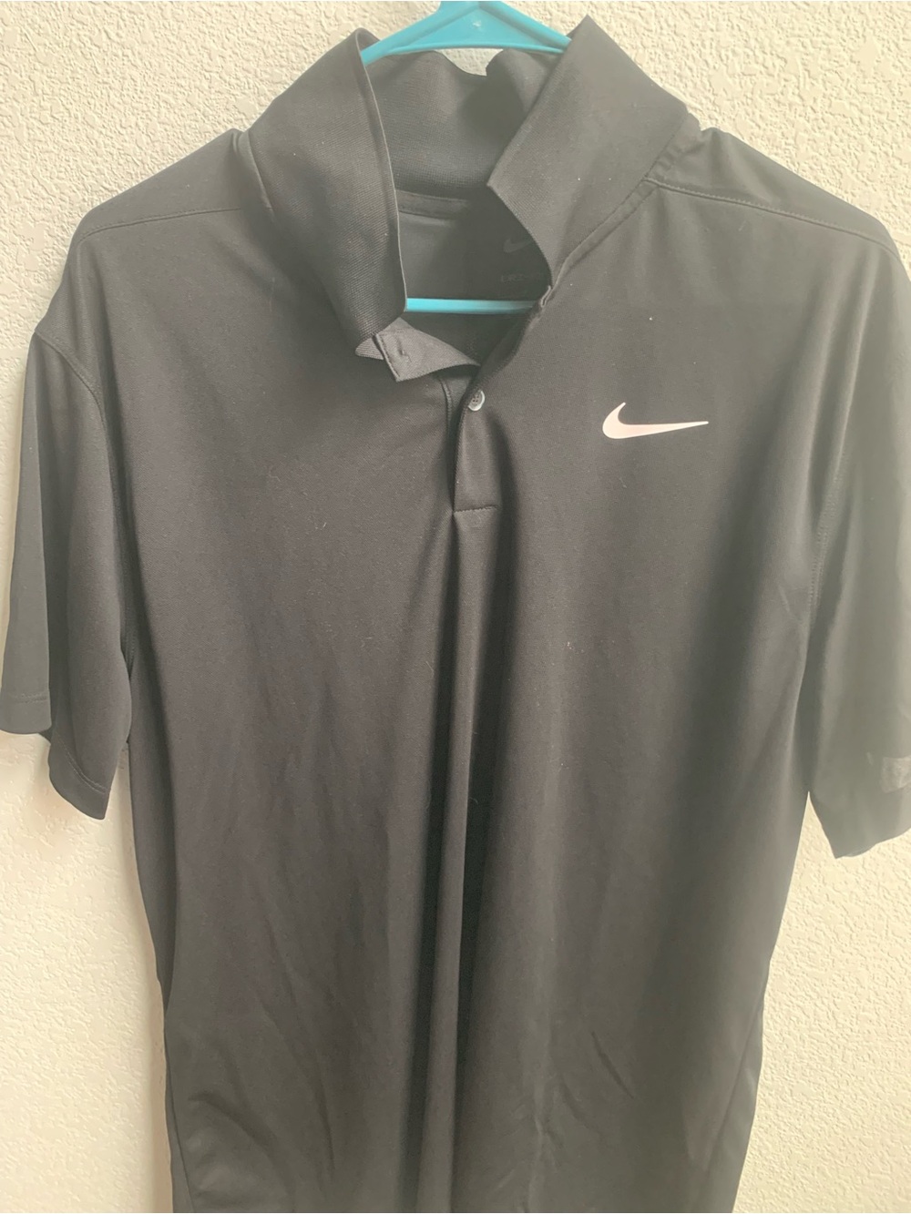 Nike Black Polo with White Swoosh Logo